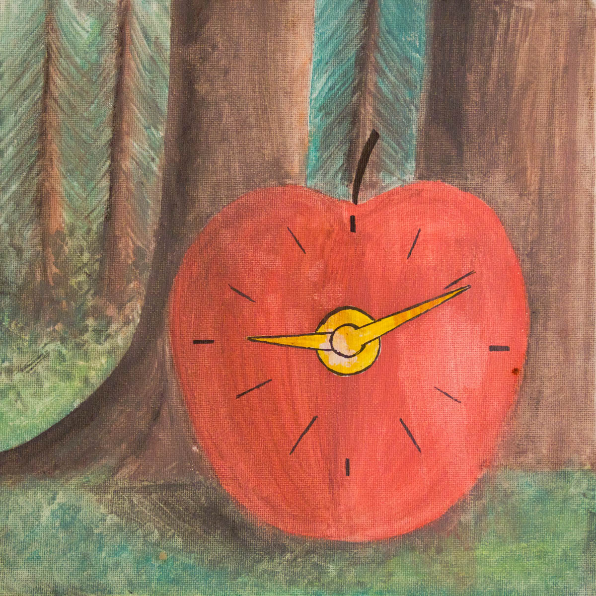 Ein Apfel mit Uhrzeigern am Waldrand
